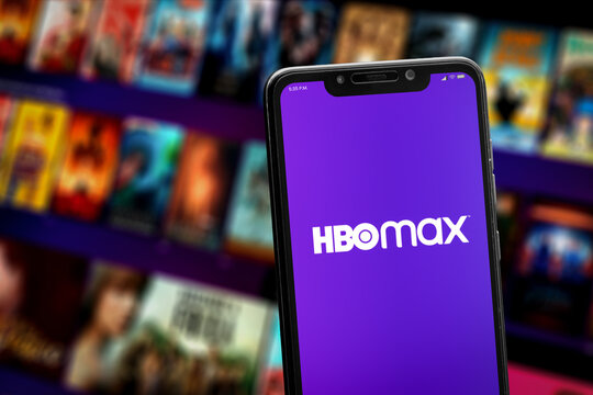 Cali, Colombia - April 20 2022: Smartphone showing HBO Max logo against blurred movie posters.