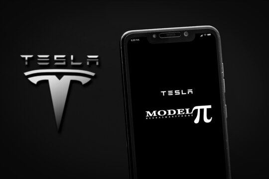 Cali, Colombia - April 20 2022: Smartphone displaying Tesla Model Pi concept next to logo.