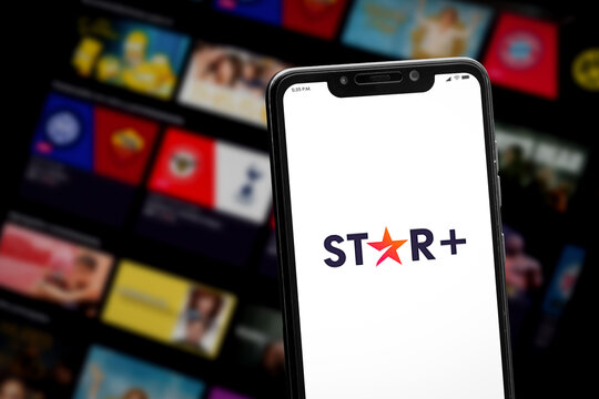 Cali, Colombia - April 22 2022: Smartphone displaying Star+ logo against blurred streaming interface.