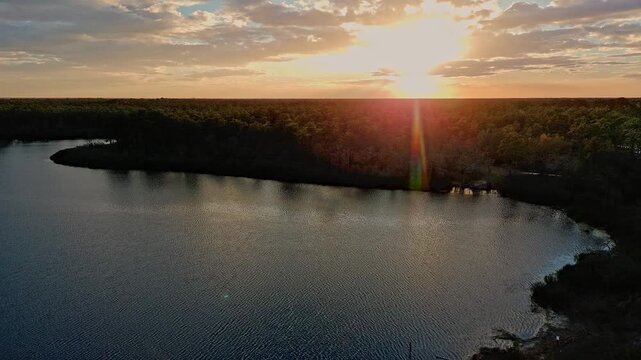 Drone footage of a sunset over a Florida lake made by a sinkhole