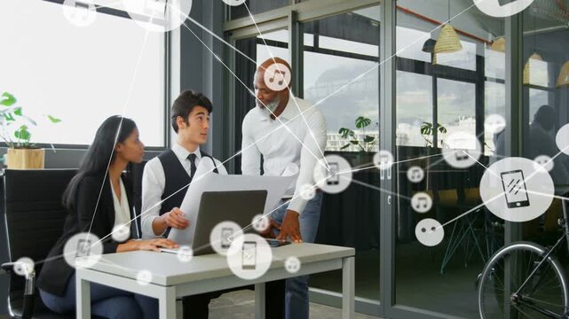 Team talking seated man showing doc causing icon network growing over group showing business links