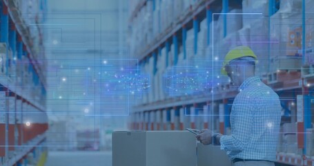 Worker wearing yellow hardhat using tablet beside pallet box in aisle with AR overlays, copy space © vectorfusionart