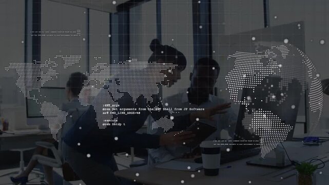 Woman leaning over peer showing tablet, both reviewing tech with globe and code overlay over team