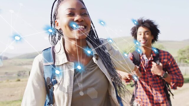 Woman leading on rural path reaching back starting blue node network across faces showing tech link