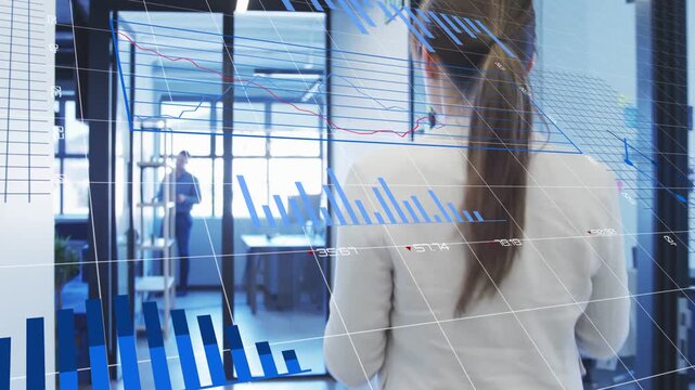 Woman walking in blazer toward glass office, consulting device, blue data charts tracking movement