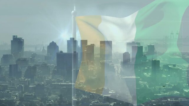 Opening aerial revealing tricolor flag overlay on city, rippling and fading, symbolizing nation