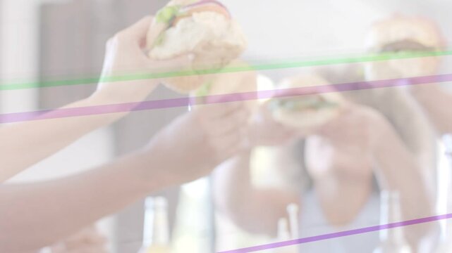 Friends lifting burgers after first lift, forming food toast with purple green overlays crossing