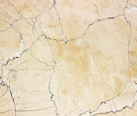 Fototapeta premium Old grunge paper background featuring a vintage cracked surface with a dirty brown antique texture and aged cement pattern