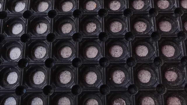 High angle shot of a non-slip rubber hollow mat with hexagonal holes, ideal for industrial drainage and safety floors