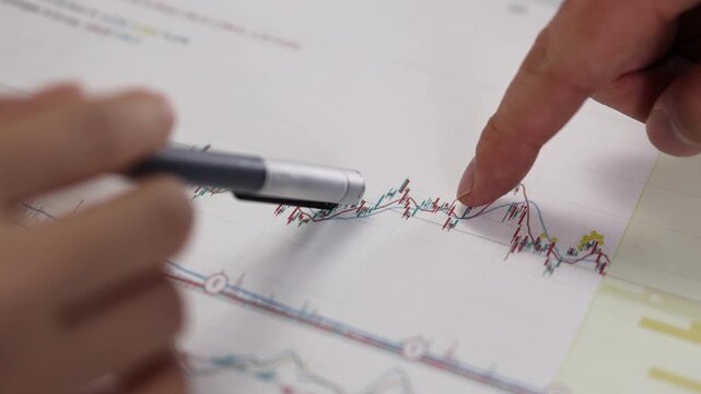 Traders analyzing and studying stock market trends
