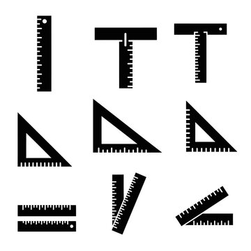 Set of black rulers and triangles on white background