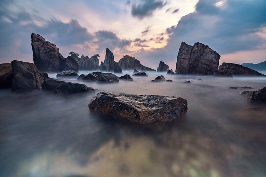 Dramatic sunset over Shark Teeth (Gigi Hiu) Beach