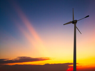 Obraz premium Wind mill power energy farm generator renewable sustainable field on suset, environment eco system technology industry ecology electricity power propeller turbine clean carbon.