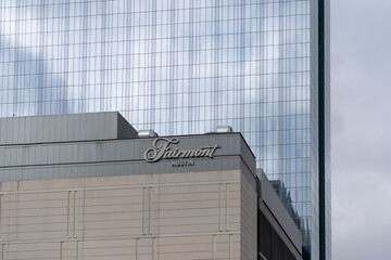 Naklejka premium Austin, Texas, USA - March 17, 2022: Fairmont Austin sign on the building in Austin, Texas, USA. Fairmont Hotels and Resorts is a global chain of luxury hotels headquartered in Toronto. 