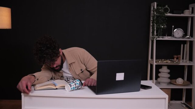 Tired student waking up to continue studying