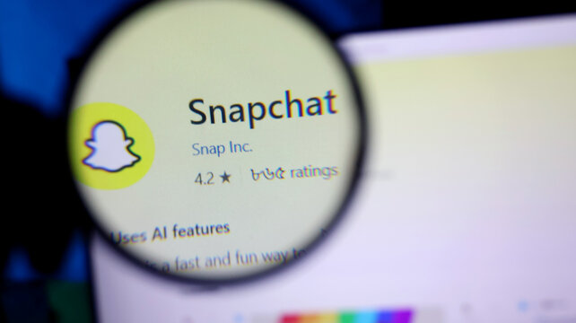 Snapchat app logo magnified on a computer screen display
