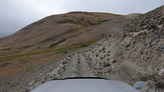 Descent from the mountain pass into the valley of the Akkul and Karakul lakes and the Akkol River in Altai.