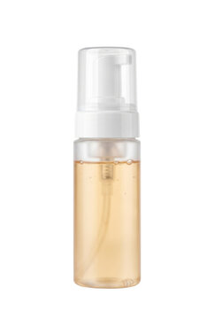 Plastic foam pump bottle with orange liquid isolated. Cosmetic packaging mockup.