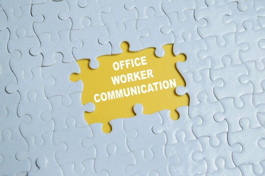 Piece of jigsaw puzzle with word office worker communication.
