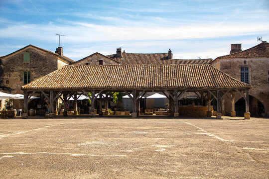 Historic wooden market hall in the medieval square of Monpazier