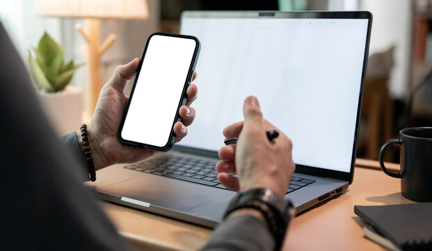 Dual mockup of blank smartphone and laptop screens inside Adobe Photoshop (Beta) interface, on a cozy home office desk.