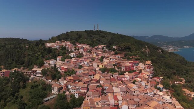 Aerial Panorama of Traditional Chlomos Village Nestled on Corfu Mountain Slopes