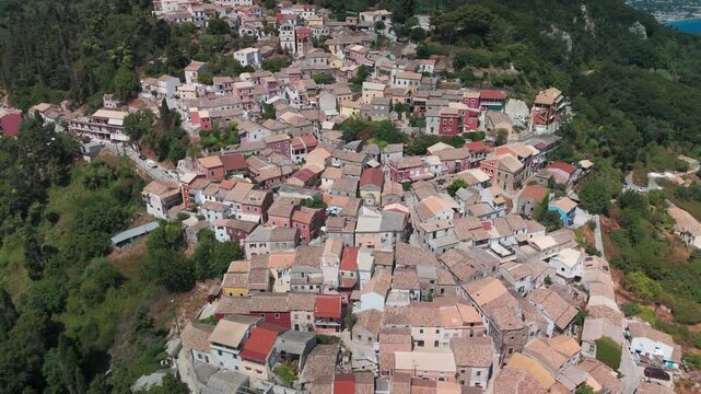 Aerial Drone Boomerang Shot Panning Out from Traditional Chlomos Village in Corfu