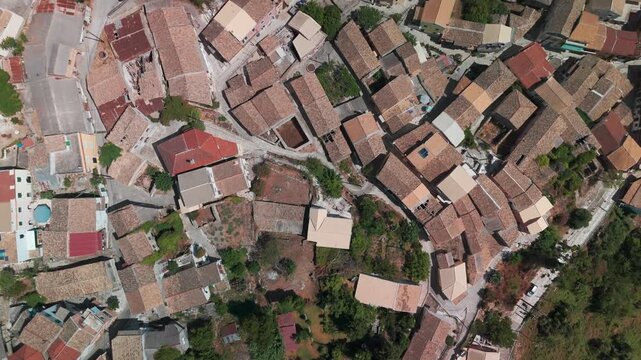 Vertical Drone Shot of Narrow Winding Streets in Traditional Greek Village Chlomos