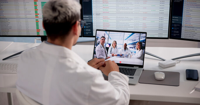Dentist Engaged In Virtual Lecture On Laptop