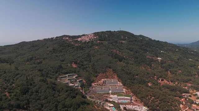 Aerial Drone Pan Out From Scenic Chlomos Village Atop Corfu Mountain Ridge
