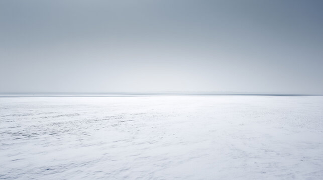 Minimalist white snow field landscape under a clear sky