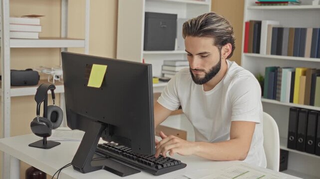 Man typing on keyboard with hands on keys then making ok gesture in building workspace; concentration productivity.