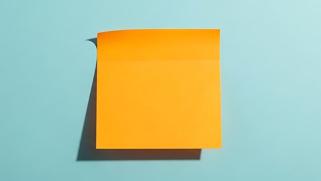 Blank orange sticky note on light blue background with background, reminder
