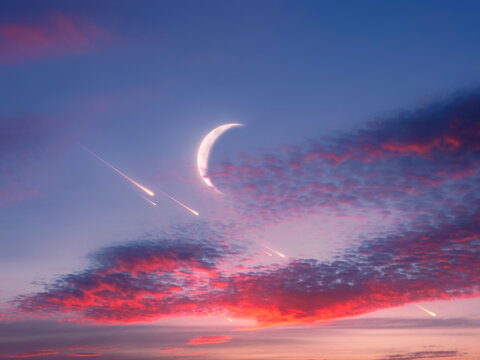 New moon in the evening sky with shooting stars. Dreamy landscape with the moon and meteor trails at sunset.