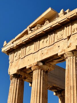 Close up of Parthenon temple over bright blue sky background, Acropolis hill, Athens