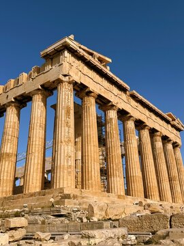Close up of Parthenon temple over bright blue sky background, Acropolis hill, Athens
