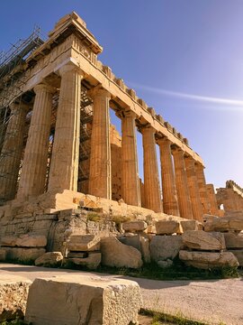 Close up of Parthenon temple over bright blue sky background, Acropolis hill, Athens,