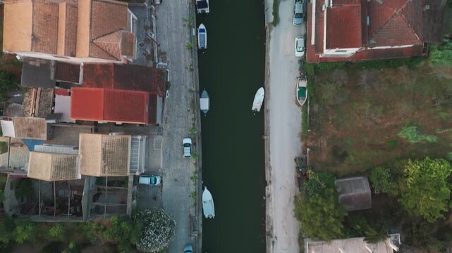 Aerial Top-Down View Moving Along Scenic Potami Lefkimmis Canal in Corfu Greece