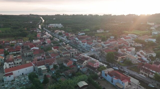 Aerial Orbit Above Lefkimmi Canal and Dense Mediterranean Town Houses in Corfu