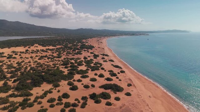 Diagonal Aerial Pan Over Issos Beach Sandy Shoreline and Turquoise Coastline in Corfu Greece