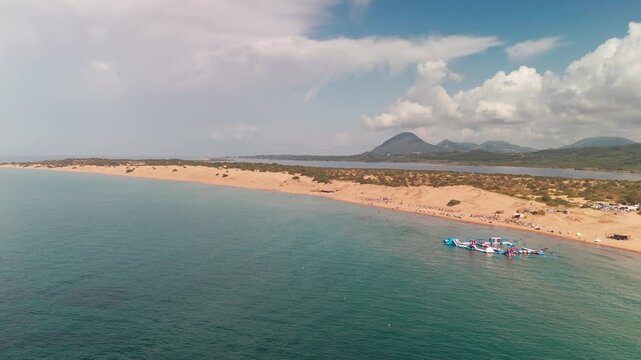 Cinematic Drone Rise Over Issos Beach Revealing Korission Lagoon and Greek Mountains