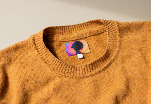 Mockup Of Clothing label on an ochre sweater