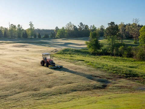 Morning dew and tractor on Robert Trent Jones Golf Trail