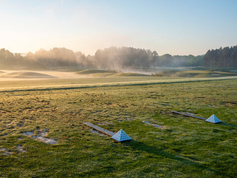 Range balls and morning mist at Hampton Cove Golf Club in Alabama