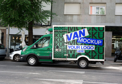A green delivery truck mockup is parked along a street in Barcelona