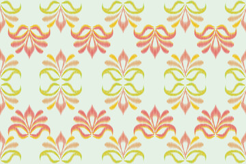 Fototapeta premium A sophisticated seamless ikat pattern featuring stylized lotus flower motifs. The design uses a soft pastel palette of coral pink, amber orange, and sage green on a light cream background.