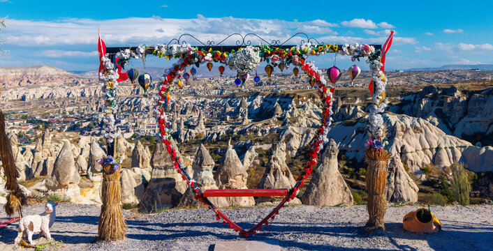 romantic heart shaped arch with panoramic view of cappadocia valley in turkey