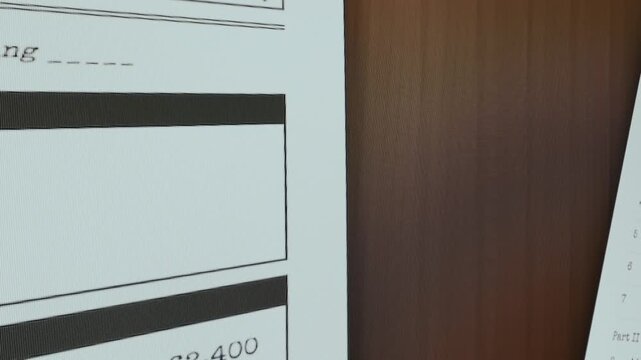 US Tax documents hanging on the wall, Question Need Help on stick paper