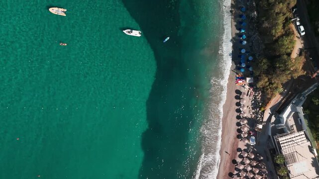 Vertical Aerial Overflight of Ermones Beach and Shimmering Ionian Sea Coastline in Corfu Greece
