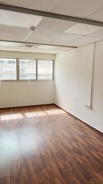 Empty office meeting room in business company building vacant without furniture or people. Closed business bankruptcy foreclosure or new modern space for start up ready for rent. UGC pov style reel